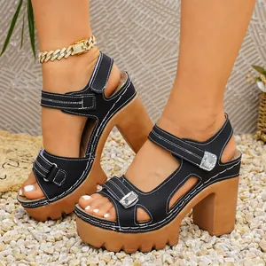 Detailed macro view of black platform sandals with magic tape and sparkly crystals