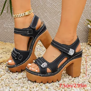 Detailed close-up showing 7.5cm block heel and Velcro straps on black platform sandals.