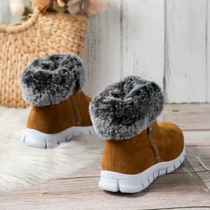 Warm women's brown suede winter snow boots with grey faux fur collars and white soles.