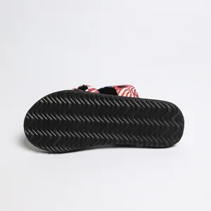 Durable anti-slip wavy textured black outsole of women's flat casual beach slide sandals