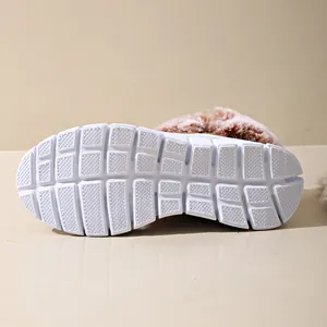 Detailed view of the anti-slip white sole on a warm plush-lined winter snow boot