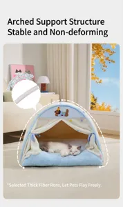 Detailed view of an enclosed tent-shaped cat bed with plush cushioning and soft polka dots