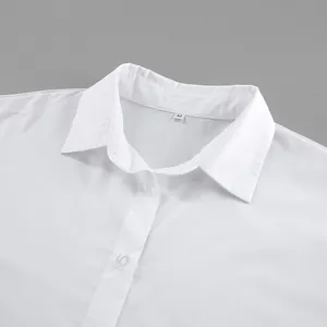 Close-up detail of a crisp white cotton shirt featuring a classic collar and size M tag