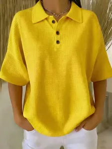 Detailed close-up showing texture of yellow waffle-knit short sleeve polo shirt for women
