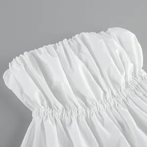Close-up of white ruched tube top showing detailed fabric texture and elastic waist