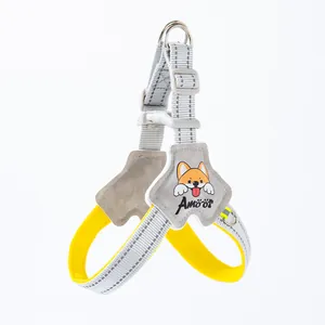 Detail view of reflective dog harness with cartoon corgi patch and adjustable buckles