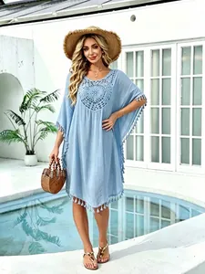 Elegant light blue crochet patchwork beach cover-up dress with stylish tassel trim detail