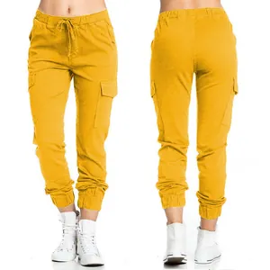 Front and back detail of yellow cargo pants with drawstring and side pockets
