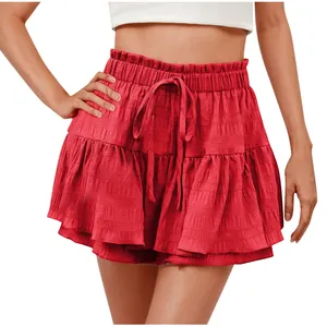Detailed macro shot of red ruffled drawstring shorts for women showing the unique fabric texture