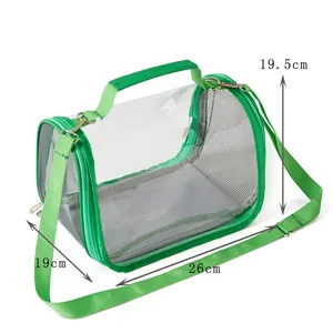 Portable green bird carrier detail showing dimensions 26cm x 19cm x 19.5cm for travel