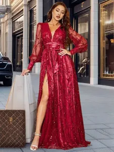 Elegant red sequined mesh evening gown with high slit and V-neck for luxury banquets.