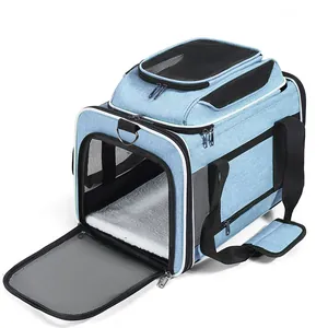 Detail showing interior fleece mat and mesh windows of a blue pet carrier bag