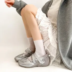 Detailed look of silver functional ballet sneakers with Mary Jane strap and mesh upper