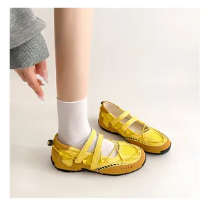 Detailed close-up view of yellow mesh functional ballet Mary Jane shoes with sporty sole