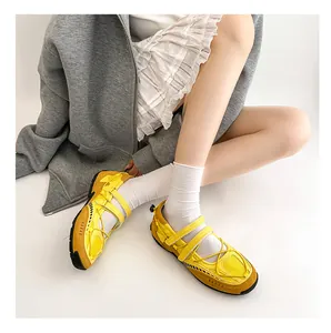 Detail view of yellow functional Mary Jane sneakers with breathable mesh and straps