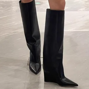 Stylish black pointed-toe wedge boots with wide straight tube pant-leg design