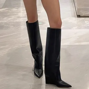 Chic black pointed-toe knee-high trouser boots with sleek wedge heels for women