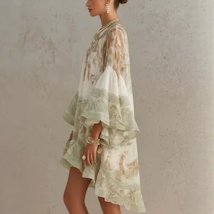 Detailed side view of flowy printed resort dress with elegant ruffled sleeves