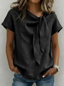 Detailed view of a black polyester blouse with a large decorative neck bow for women