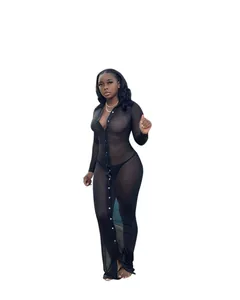Detail of sheer black long-sleeve maxi dress with deep V-neck and button closure
