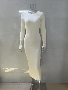 Detailed shot of a white rib-knit long sleeve bodycon maxi dress shown on a mannequin