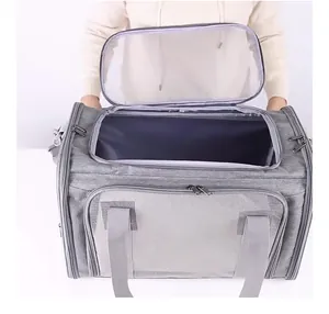 Detail view of the wide top mesh opening on a grey foldable large pet carrier bag