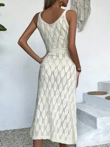 Detailed back view of a white crochet hollow-out knit midi dress for summer vacation
