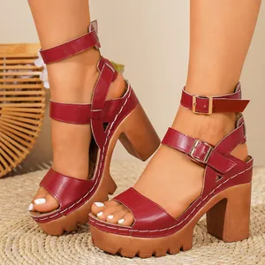 Detailed side view of red platform chunky heel Roman sandals with multiple buckle straps