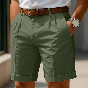 Detail of olive green men's pleated shorts with cuffed hem for business casual look