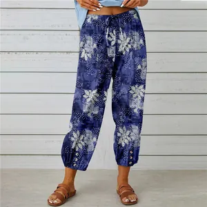 Model wearing floral print high waist drawstring linen cropped pants with sandals