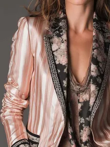 Detailed view of bohemian striped blazer with floral lapels and metallic sheen texture