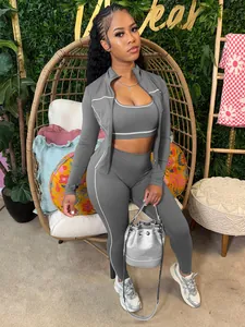 Set sportivo da donna tre pezzi con giacca con zip e leggings in tonalità grigio scuro