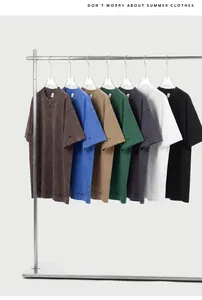 Selection of distressed heavy cotton oversized T-shirts hanging on a minimalist metal rack