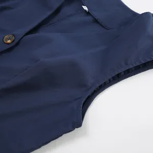 Close-up detail view of navy blue cotton linen sleeveless vest with elegant V-neckline