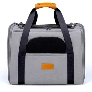 Grey foldable pet carrier bag with breathable mesh windows and brown leather handle