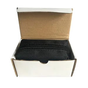 Close-up of a black zippered dog poop bag dispenser inside an open white cardboard box.