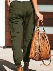 Back view of women's army green cargo pants with pockets and elastic cuffs