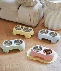 Non-slip stainless steel pet double bowls in pastel colors shown in a home setting
