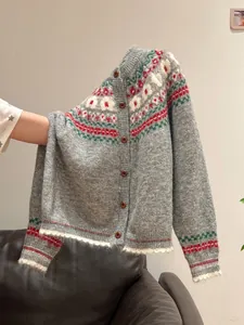 Detail of vintage Fair Isle knit cardigan with colorful patterns and soft texture
