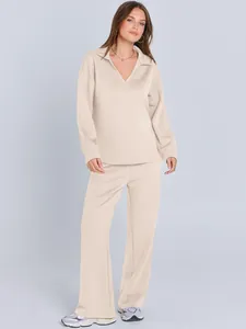 Stylish beige women's lounge set featuring long sleeve V-neck top and wide-leg pants