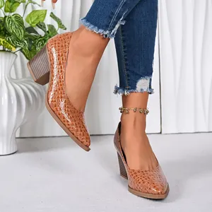 Elegant tan crocodile pattern pointed-toe chunky heel pumps for stylish office wear.