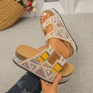 Detailed view of women's platform slides with pearl and rhinestone embellishments.