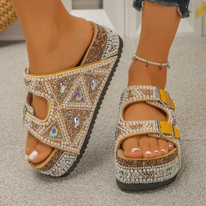 Detailed view of yellow strap platform sandals decorated with white pearls and shiny rhinestones