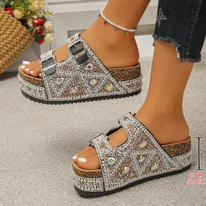 Detailed side view of pearl and rhinestone platform sandals with a 5.9cm cork heel
