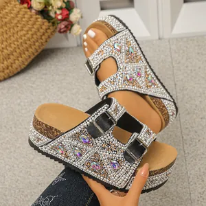 Detailed view of women's platform slides with sparkling pearls and iridescent rhinestones