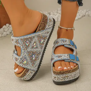 Close-up of luxury pearl and iridescent rhinestone embellished platform sandals with cork soles