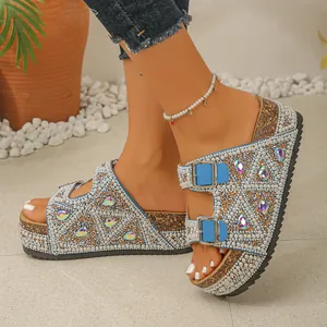 Detailed shot of women's platform slides featuring pearl and rhinestone embellishments.