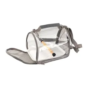 Detail view of portable bird carrier bag featuring wooden perch and removable tray