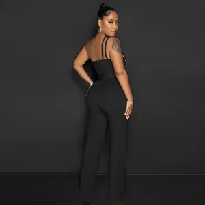Elegant back view of a sleek black one-shoulder jumpsuit with wide-leg trousers