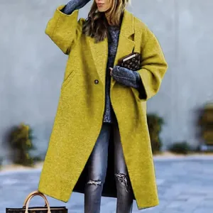 Detailed street style view of mustard yellow long wool coat with elegant lapel collar